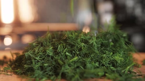 Cutting Dill Chef Cut Dill with Knife on a Wooden Board Close Up at Home