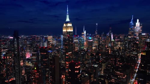 Going over the spectacular panorama of Manhattan at night.