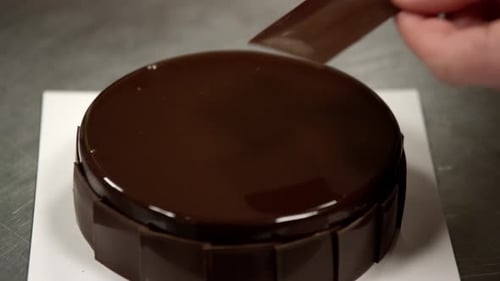 Adding Chocolate to Delicious Dessert Cake