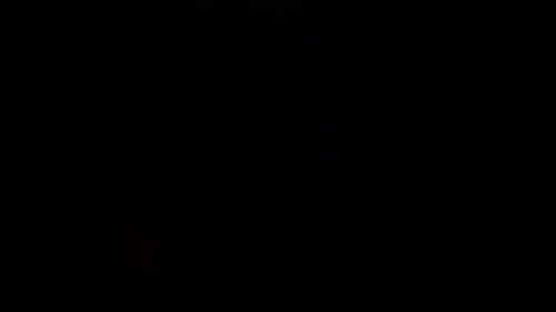 Determined Woman Boxing with Punching Gloves