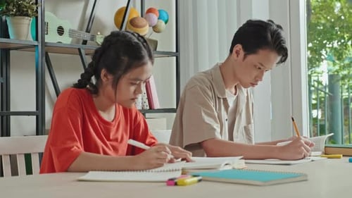 Asian Classmates Doing Assignment at School