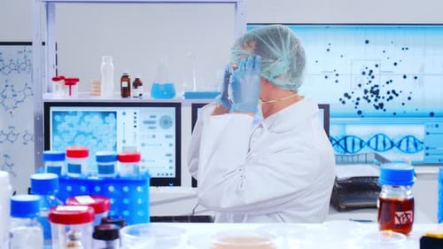 Scientist Working in Bright Laboratory