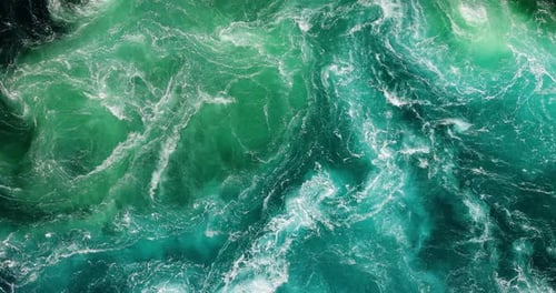 Blue waves of water of the river and the sea meet each other during high tide and low tide.