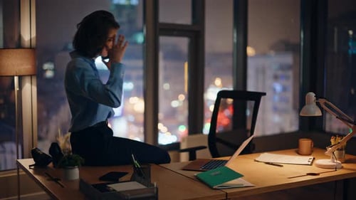 Business Woman Working Late in City Office