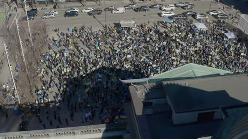 Aerial view of large crowd with Ukraine flags