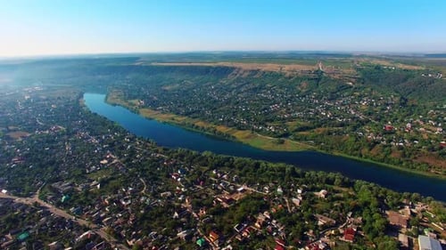 Picturesque city with narrow river dividing it into two banks.