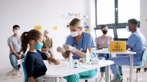 Child Receives Vaccine in Modern Clinic Setting