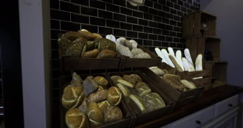 Freshly Baked Artisan Breads Displayed in a Cozy Bakery Setting