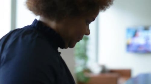 Businesswoman Arriving Sitting Down for Meeting in Office 2529 Years