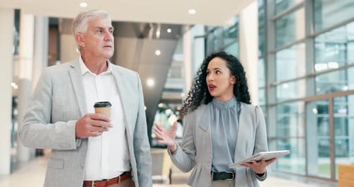 Business Colleagues Discussing Work in Office Building