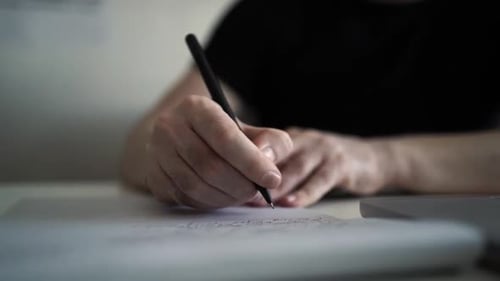 Creative Journaling: Man Working from Home Office