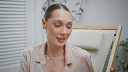 Glamorous Woman in Light Blouse and Pearl Necklace