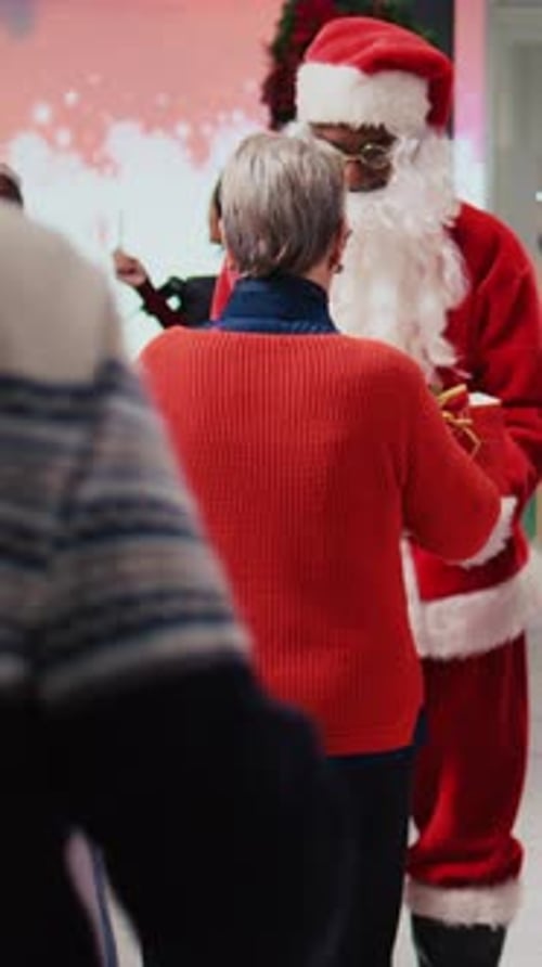 Vertical Video Santa Claus Employee Holding Raffle