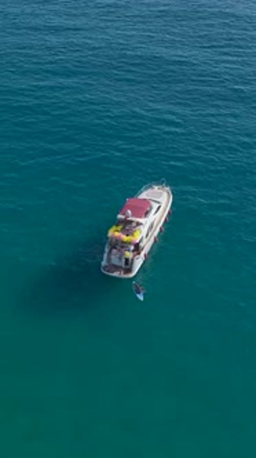 Vertical Video Stunning Summer Days at Sea With Yachts Carrying Relaxed Tourists Exploring Scenic