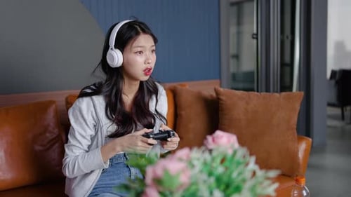 Excited Woman Playing Video Games on Console