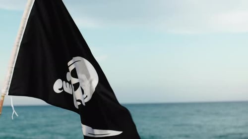 Pirate Flag Waving on a Peaceful Beach