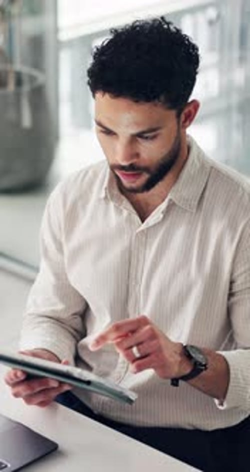 Reading, paperwork and businessman with tablet in office, planning or review budget report