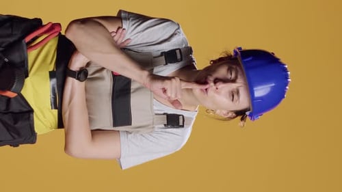 Vertical Video Portrait of Construction Worker Doing Hush Mute Sign