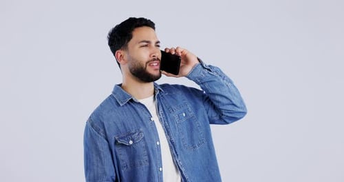 Man, talking and phone call in studio for contact, networking or funny conversation on white