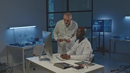 Scientists Collaborate on a Tech Project in Lab