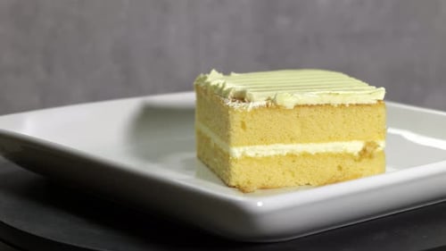 Slice of Creamy Cake on a White Plate