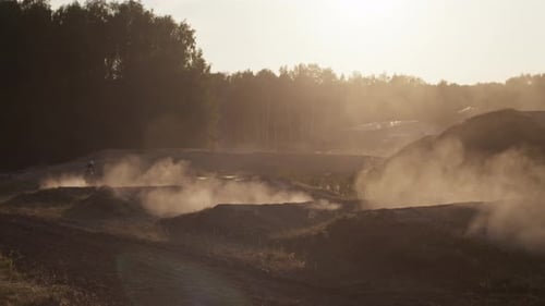 Dirt Bike Rider Racing on Rural Motocross Course