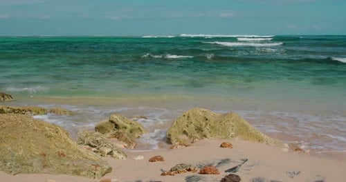 Clear Ocean Water and Blue Sky on Tropical Sandy Green Bowl Beach Bali Island