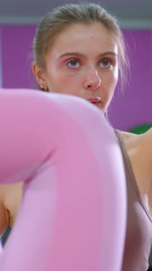 Fitness Coach Supervises Abdominal Workout in Gym