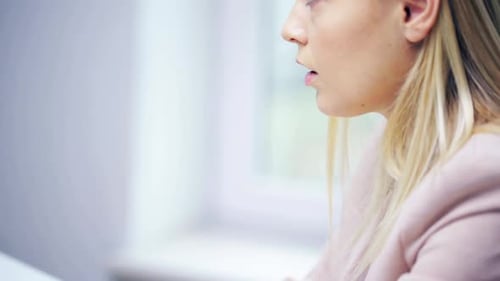 Stressed young businesswoman at office facing business problems and technology issues