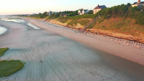 Cape Cod Bay Aerial Drone Footage of Beach Front Houses at Low Tide with Lowering Motion