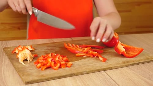 Slicing Red Pepper on a Cutting Board