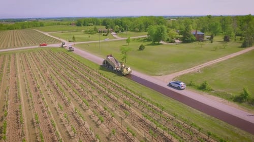 A road being paved by a construction crew on a sunny day