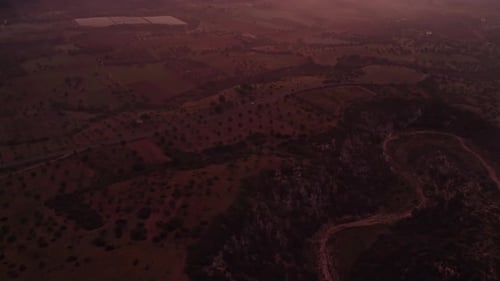 Aerial view of foggy countryside fields at sunrise, Ginosa, Italy.