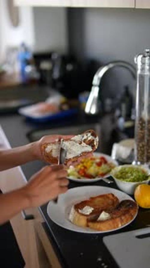 Preparing sandwich in bright, modern kitchen