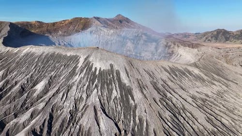 Beautiful aerial over crater rim to active volcano. Mount Bromo, Java, Indonesia.
