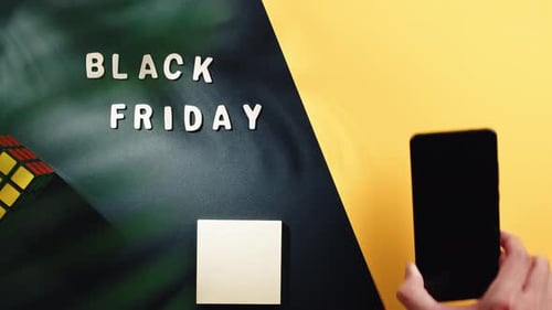 Black Friday Sale With Mobile Phone On Display