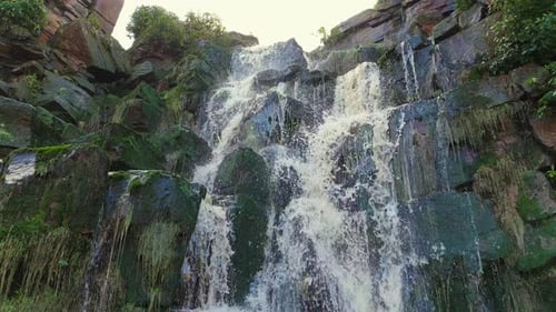 Aerial drone footage of a tall rocky waterfall in the Yorkshire Dales, Pennies. Moorland scene of a