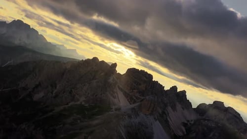 Epic Sunset Over Dolomites with Sun Rays and Dramatic Clouds