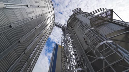 Dramatic Low Angle View of Agricultural Grain Silos