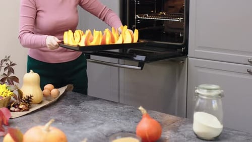 Preparing to Bake Sliced Orange Pumpkin in Oven Chopped Sweet Pumpkin Baking