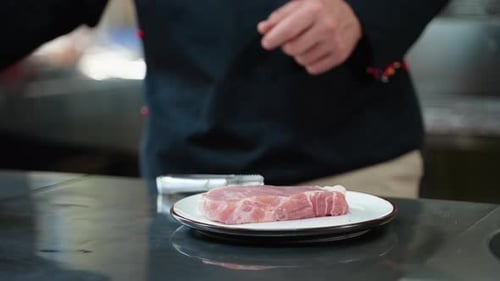 Chef Seasons Raw Steak with Salt and Pepper