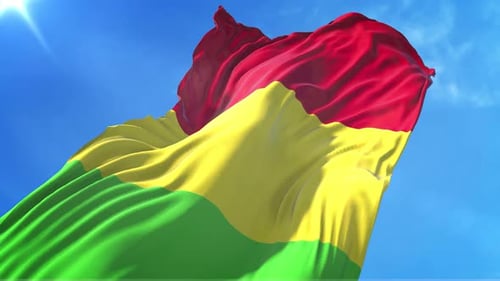 Realistic Red Yellow Green Flag Waving in Blue Sky