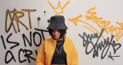 Female Street Hooligan Dances Carefree Keeps Arms Raised Enjoys Spending Free Time