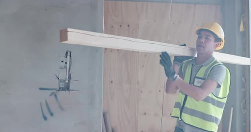 Builder, man and carry wood for construction, carpentry industry and building renovation