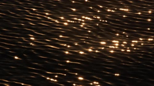 The sea's surface glittered with sparks.
