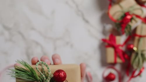 Hand Holding Decorated Christmas Gift Close Up