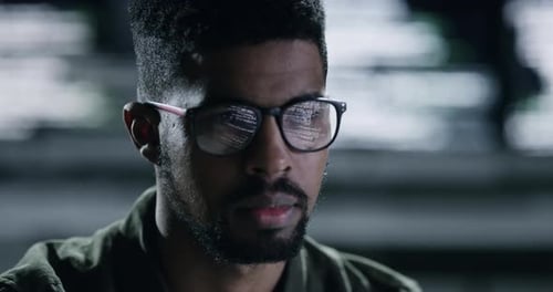 Face, glasses and database with a man programming working in a dark office for data processing