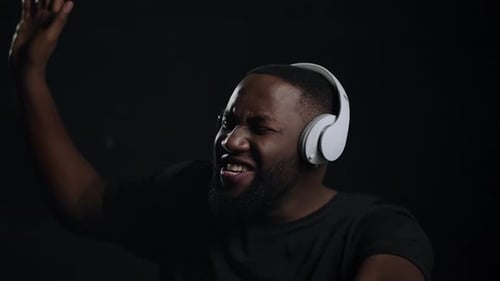 Emotional Afro Guy Singing in Studio. Closeup African American Man Looking At