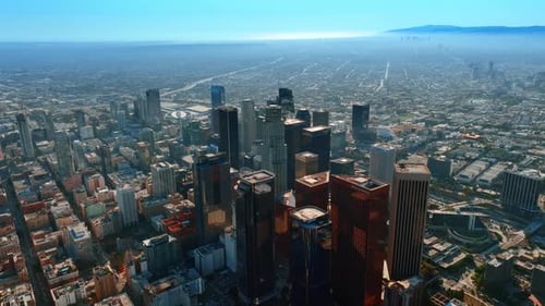 Footage high above the downtown high-rise architecture. Sunny view of Los Angeles, California