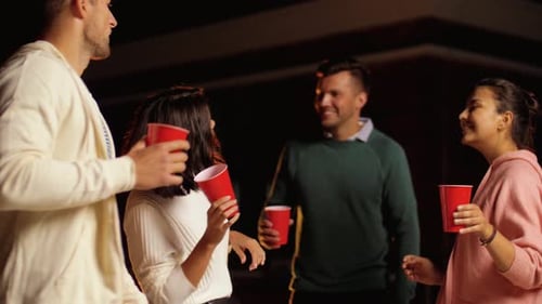 Friends Toasting Drinks Together at Night